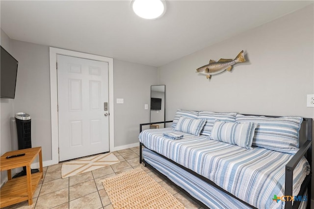 1113 W Port Dr, Port Mansfield, TX 78598 - bedroom with baseboards and light tile patterned flooring