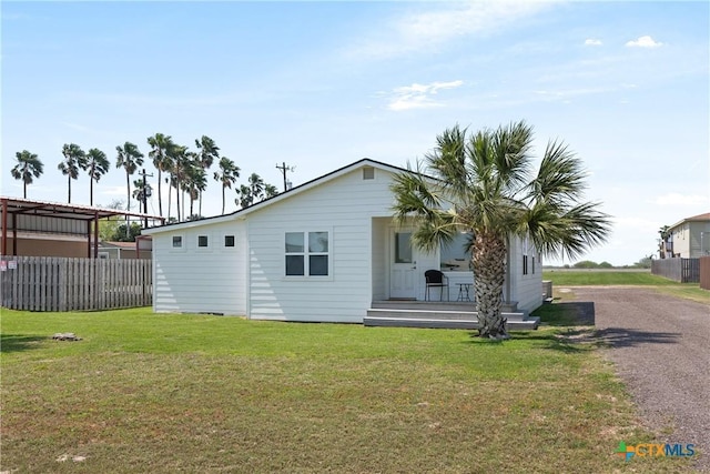 1113 W Port Dr, Port Mansfield, TX 78598 - view of home's exterior with covered porch and driveway