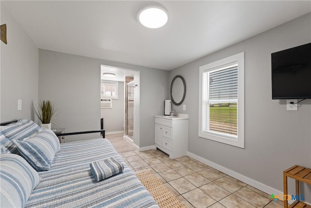 1113 W Port Dr, Port Mansfield, TX 78598 - bedroom with light tile patterned floors and ensuite bath