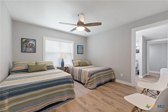 1113 W Port Dr, Port Mansfield, TX 78598 - bedroom with light wood-type flooring and a ceiling fan