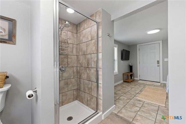 1113 W Port Dr, Port Mansfield, TX 78598 - full bathroom with a shower stall and tile patterned floors