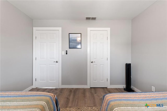 1113 W Port Dr, Port Mansfield, TX 78598 - bedroom featuring wood finished floors and baseboards