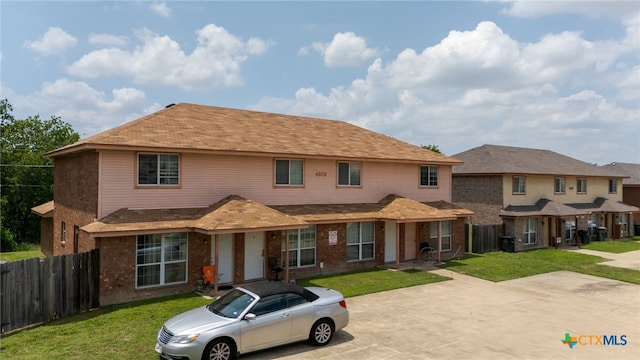 4509 Mattie Dr Unit A-D, Killeen, TX 76549 - view of front facade featuring brick siding and roof with shingles