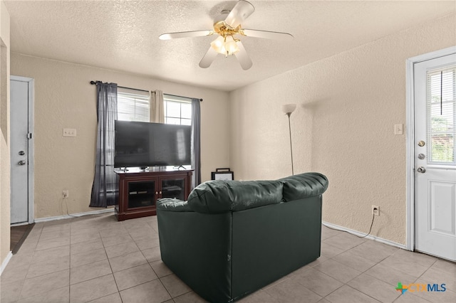 4509 Mattie Dr Unit A-D, Killeen, TX 76549 - living area with a textured wall, plenty of natural light, a ceiling fan, a textured ceiling, and light tile patterned floors
