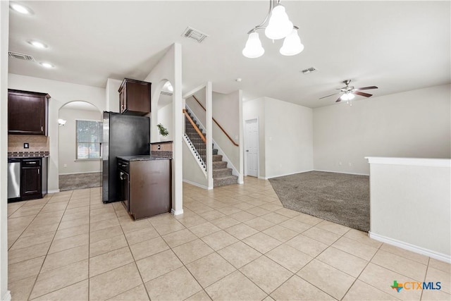 703 Curtis Dr, Killeen, TX 76542 - kitchen featuring dark brown cabinets, light tile patterned floors, a ceiling fan, and appliances with stainless steel finishes