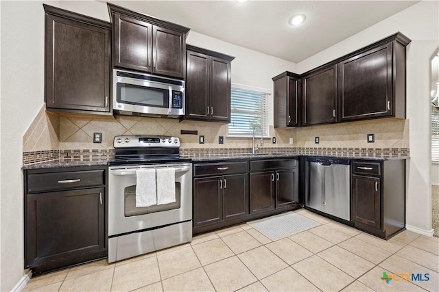 703 Curtis Dr, Killeen, TX 76542 - kitchen featuring stainless steel appliances, dark brown cabinets, decorative backsplash, light tile patterned flooring, and recessed lighting