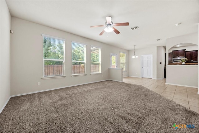 703 Curtis Dr, Killeen, TX 76542 - unfurnished living room featuring ceiling fan, light carpet, and light tile patterned floors