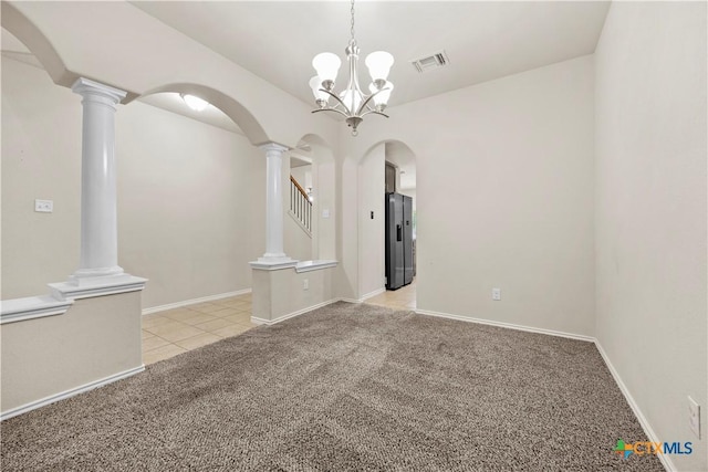 703 Curtis Dr, Killeen, TX 76542 - spare room with arched walkways, light carpet, light tile patterned flooring, and decorative columns