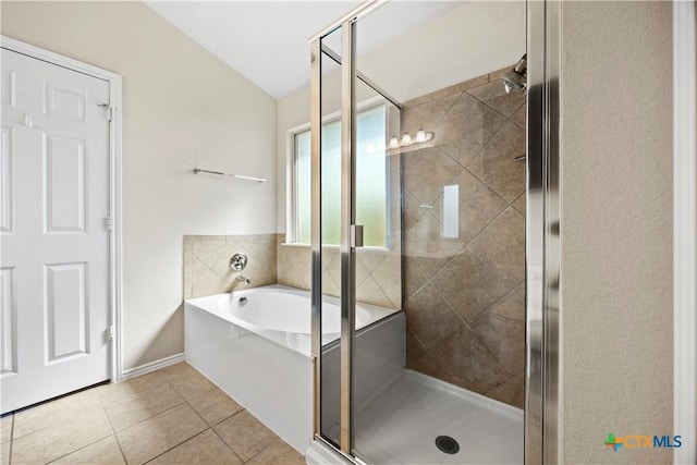 703 Curtis Dr, Killeen, TX 76542 - full bathroom featuring a bath, a shower stall, tile patterned floors, and vaulted ceiling