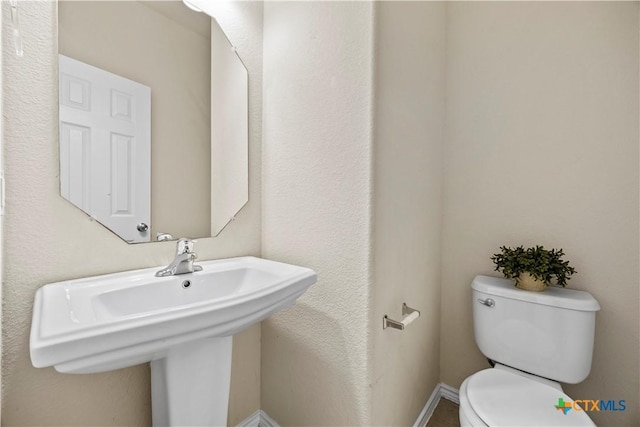 703 Curtis Dr, Killeen, TX 76542 - half bathroom with toilet and a sink