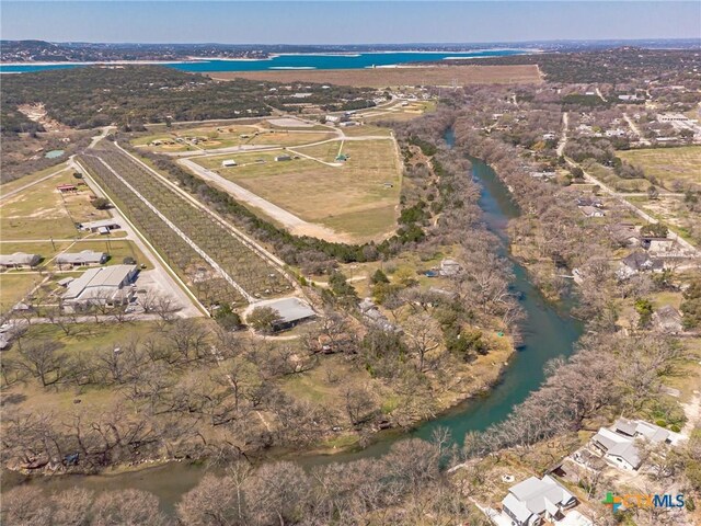 1009 Edgewater Fls, Canyon Lake, TX 78133 - aerial overview of property's location with a nearby body of water