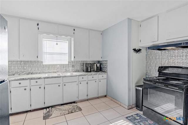 kitchen with white cabinetry, electric range, sink, and light tile patterned flooring