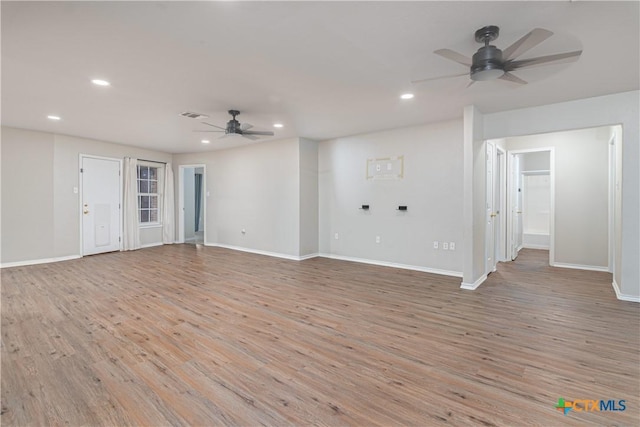 unfurnished room featuring recessed lighting, visible vents, and wood finished floors