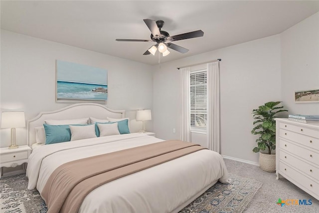 bedroom featuring carpet, baseboards, and ceiling fan