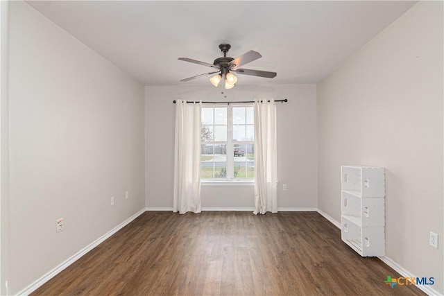 unfurnished room featuring ceiling fan, baseboards, and wood finished floors