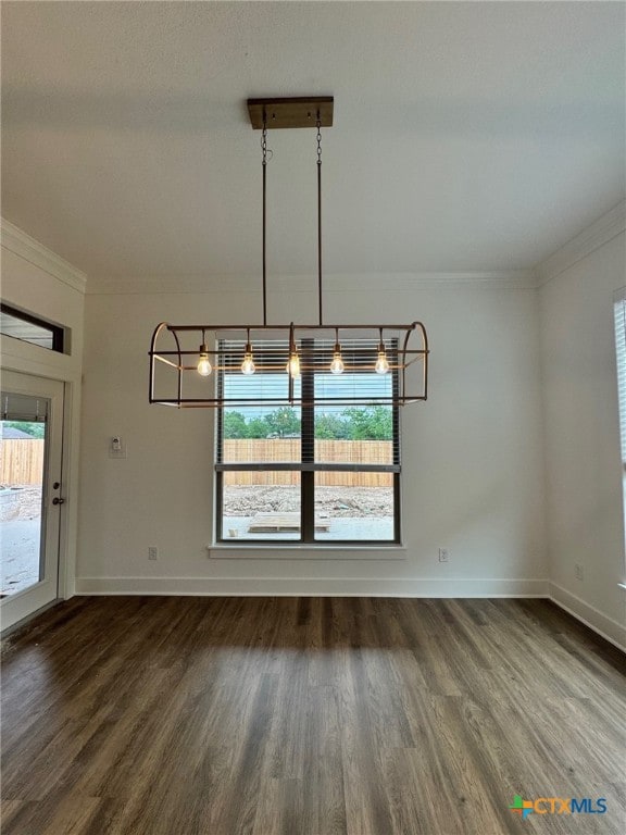 10826 Campsite Cv, Temple, TX 76502 - unfurnished dining area with ornamental molding, dark wood-type flooring, and plenty of natural light