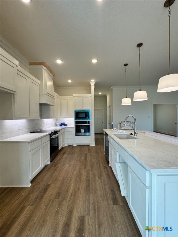 10826 Campsite Cv, Temple, TX 76502 - kitchen with ornamental molding, a sink, backsplash, black appliances, and dark wood-style floors