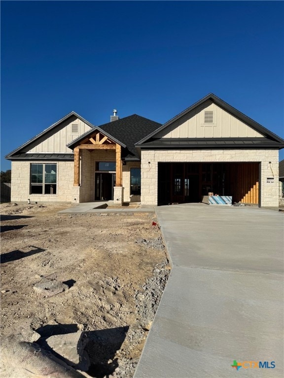 unfinished property featuring a garage