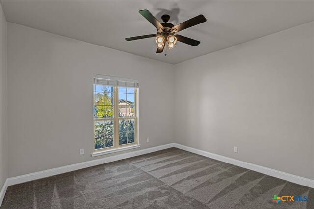 carpeted empty room with ceiling fan