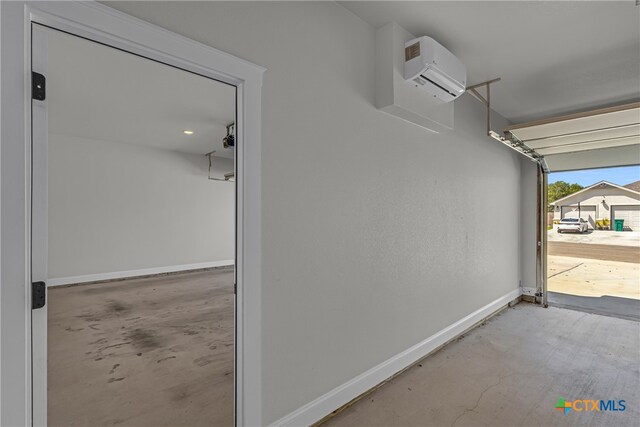 garage with a wall mounted air conditioner