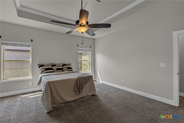 carpeted bedroom with ceiling fan and crown molding