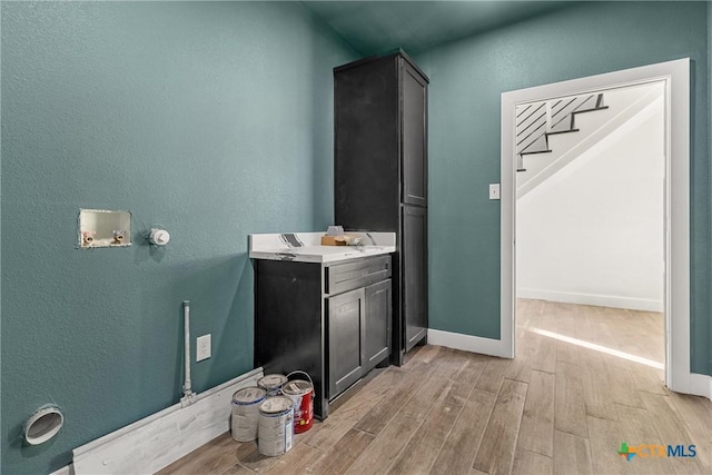 bathroom with hardwood / wood-style flooring and vanity