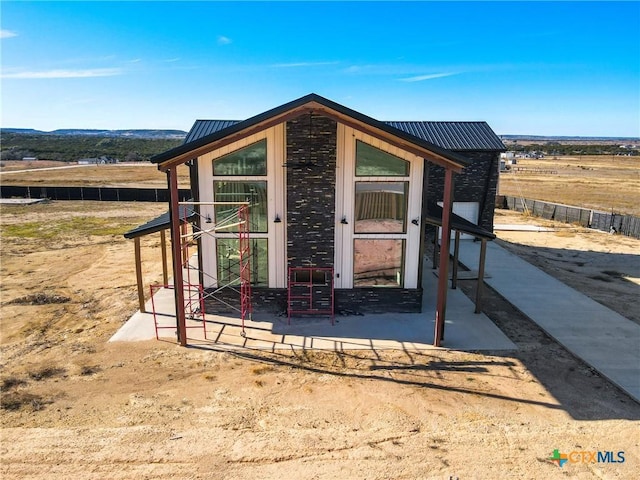 view of outbuilding with a rural view