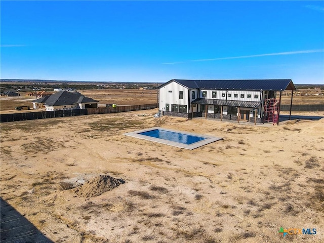 exterior space with a patio area and a rural view