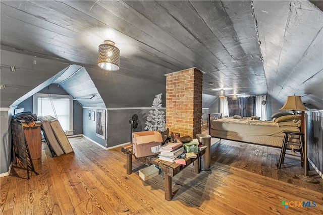 bonus room featuring wood-type flooring, vaulted ceiling, and wood ceiling