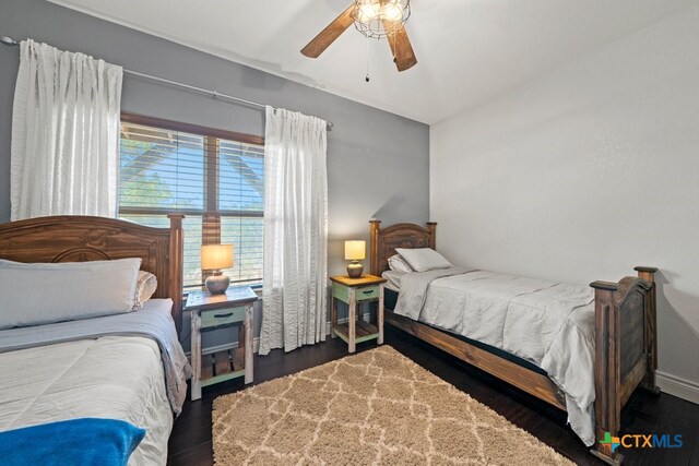 bedroom featuring wood finished floors and ceiling fan