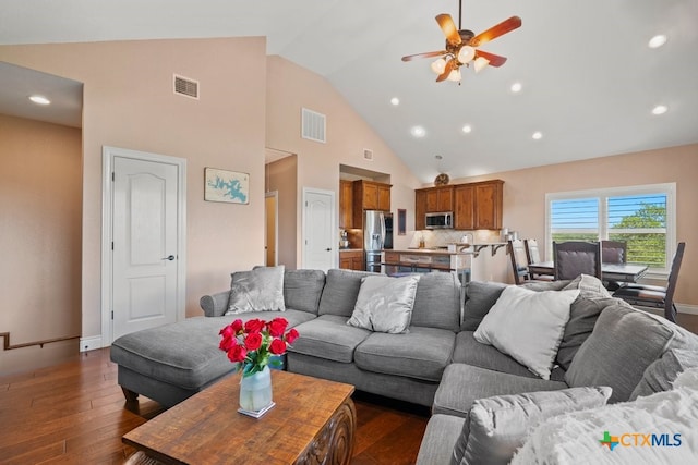 living area featuring a ceiling fan, dark wood-style flooring, recessed lighting, high vaulted ceiling, and baseboards