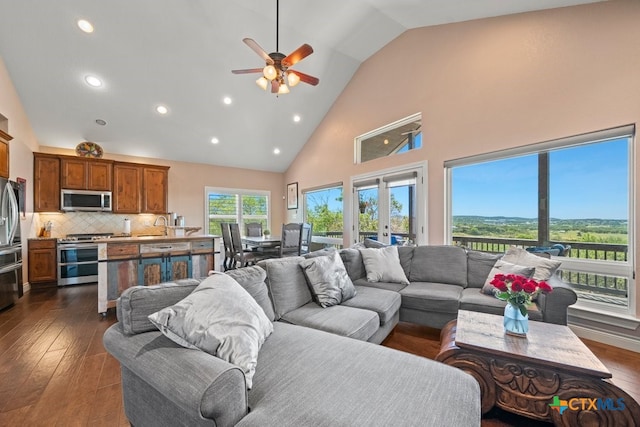 living room with high vaulted ceiling, a ceiling fan, dark wood-style floors, and recessed lighting