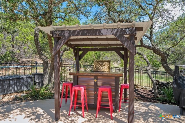 view of patio featuring fence