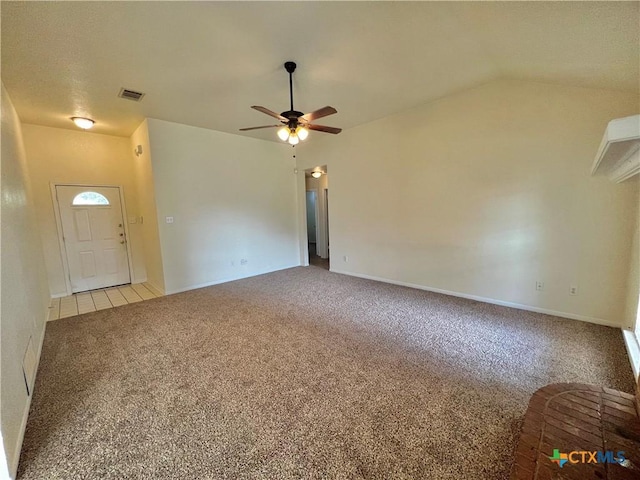 unfurnished living room featuring vaulted ceiling, light carpet, and ceiling fan