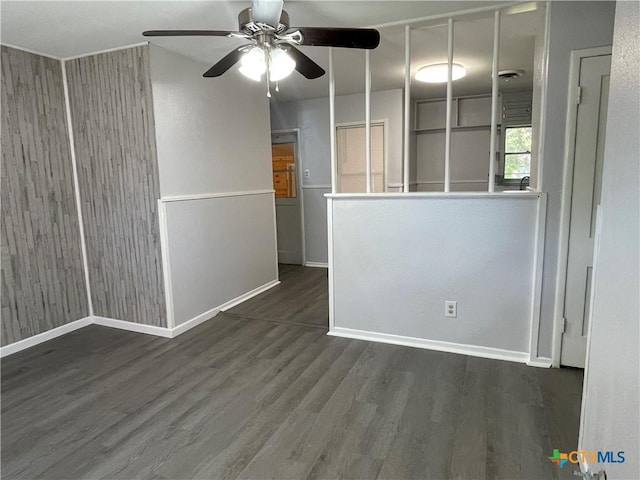 spare room featuring ceiling fan and dark hardwood / wood-style flooring