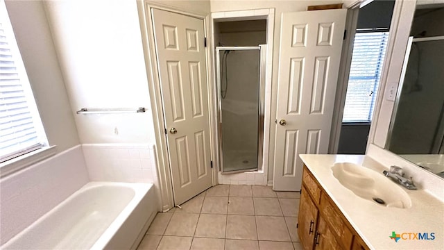 bathroom with vanity, tile patterned floors, and independent shower and bath