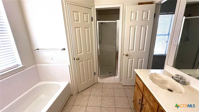 1302 Creek St, Copperas Cove, TX 76522 - full bathroom with plenty of natural light, tile patterned flooring, a stall shower, and vanity