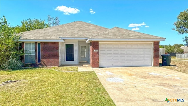 ranch-style home with a garage and a front lawn