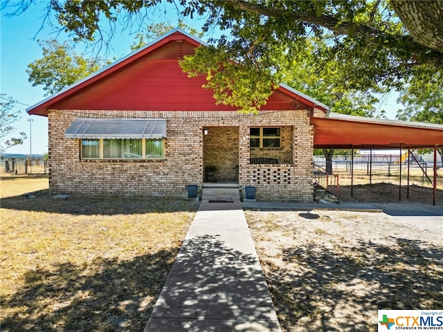210 N 8th St, Lometa, TX 76853 - view of front facade featuring brick siding