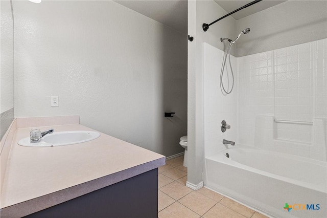 full bath featuring  shower combination, toilet, vanity, and tile patterned floors