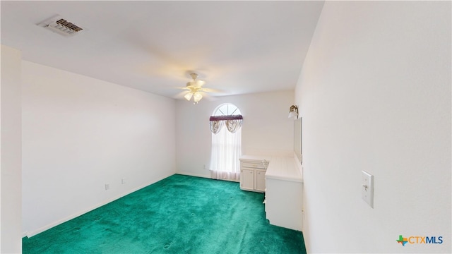 901 E Sarah St, Cuero, TX 77954 - carpeted empty room featuring ceiling fan and baseboards