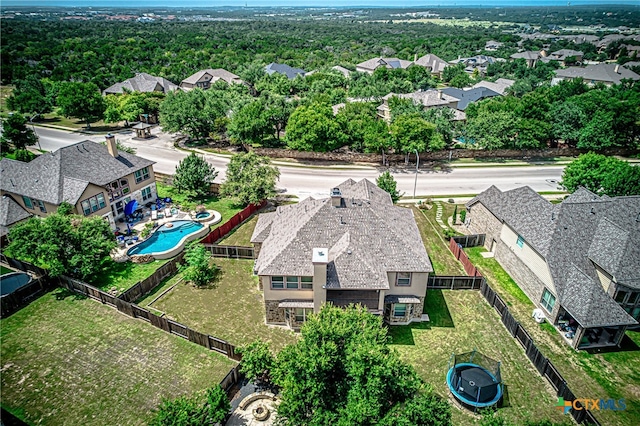 birds eye view of property with a residential view