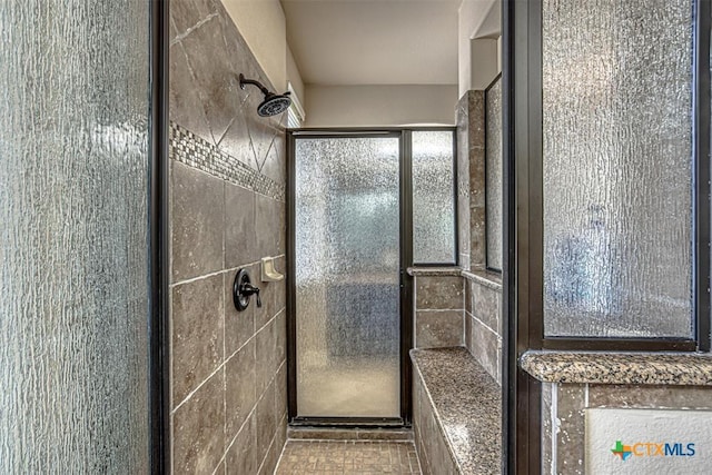 bathroom featuring a stall shower