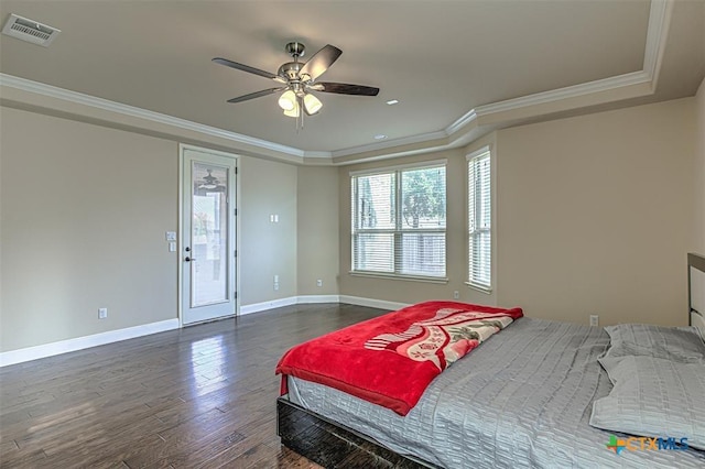 bedroom with visible vents, baseboards, ornamental molding, and dark wood-style flooring