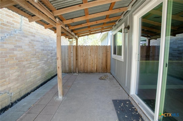 view of patio / terrace featuring fence