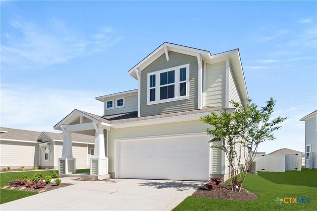 128 Bluestem Dr, Elgin, TX 78621 - view of front of home with a garage and driveway