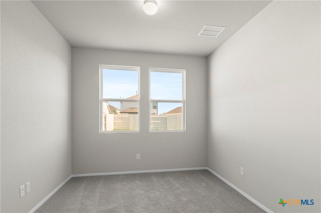 128 Bluestem Dr, Elgin, TX 78621 - spare room with carpet floors and baseboards