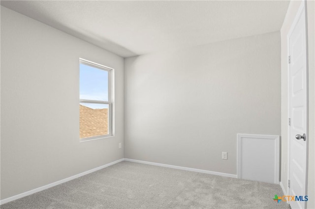 128 Bluestem Dr, Elgin, TX 78621 - carpeted empty room featuring baseboards
