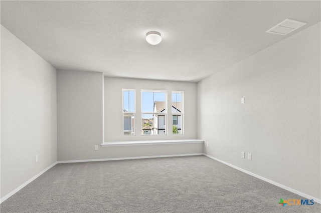 128 Bluestem Dr, Elgin, TX 78621 - carpeted spare room featuring baseboards