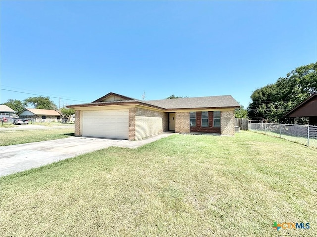 view of front facade featuring brick siding, concrete driveway, a front yard, fence, and a garage